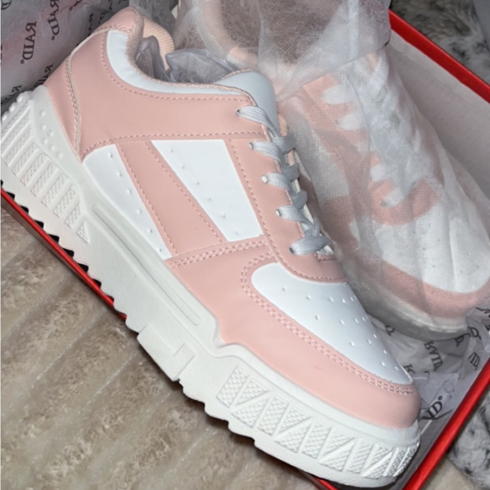 Pink and white sneakers